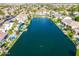 Stunning aerial view showcasing lakefront homes, lush landscaping, and community waterfront at 633 W Aster Ct, Chandler, AZ 85248