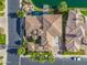 Aerial view of a luxury home featuring a pool, spa, and waterfront access on a serene lake at 633 W Aster Ct, Chandler, AZ 85248