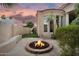 The backyard showcases a fire pit, artificial turf, and thoughtful landscaping to create an inviting space at 633 W Aster Ct, Chandler, AZ 85248