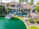 Gorgeous home with a custom pool, waterfront access, gazebo, and immaculate landscaping at 633 W Aster Ct, Chandler, AZ 85248