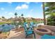 Beautiful backyard patio with fire pit and lake views offering a relaxing outdoor oasis at 633 W Aster Ct, Chandler, AZ 85248