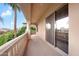 A covered outdoor balcony with views of the lake and landscaping at 633 W Aster Ct, Chandler, AZ 85248