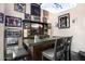 Sports themed bar area with custom bar, flat screen tv, and lots of sports memorabilia at 633 W Aster Ct, Chandler, AZ 85248