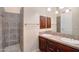 Beautifully tiled bathroom with large walk-in shower and dual sinks with modern fixtures at 633 W Aster Ct, Chandler, AZ 85248