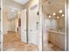 This spacious bathroom features a shower with tile surround and convenient built-in shelving at 633 W Aster Ct, Chandler, AZ 85248