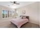 Bright bedroom with shutters, plush carpet and a cozy pink bedspread at 633 W Aster Ct, Chandler, AZ 85248