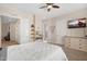 Bedroom with adjacent dressing area, light walls and an entertainment center at 633 W Aster Ct, Chandler, AZ 85248