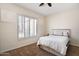 Bedroom featuring carpeted floors, shutters, and a neutral color palette at 633 W Aster Ct, Chandler, AZ 85248