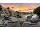 Lakeside dock with lounge chairs and a boat, offering a relaxing waterfront experience at sunset at 633 W Aster Ct, Chandler, AZ 85248