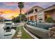 Expansive backyard features a boat dock, swimming pool, water slide, and beautiful waterfront views at 633 W Aster Ct, Chandler, AZ 85248