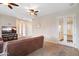 Living room with plush seating, a modern entertainment center, and neutral decor at 633 W Aster Ct, Chandler, AZ 85248