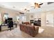 Spacious living room featuring a fireplace, comfortable seating, and a view of the outdoors at 633 W Aster Ct, Chandler, AZ 85248