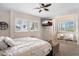 Bright and airy main bedroom featuring plantation shutters, modern furnishings and en suite bathroom at 633 W Aster Ct, Chandler, AZ 85248