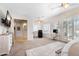 Open primary bedroom with a large carpeted area, desk, and massage chair at 633 W Aster Ct, Chandler, AZ 85248