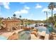Gorgeous pool and spa with waterfall feature overlooking the serene lake and backyard at 633 W Aster Ct, Chandler, AZ 85248