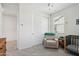 Bright Bedroom with neutral tones, featuring a crib and soft armchair at 670 S Beebe St, Gilbert, AZ 85296