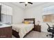 Bright bedroom with a ceiling fan, comfortable bed, and modern furnishings create a relaxing retreat at 670 S Beebe St, Gilbert, AZ 85296