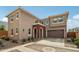 Charming two-story home featuring a brick arched entryway and attached two-car garage at 670 S Beebe St, Gilbert, AZ 85296