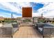 Outdoor fireplace area with comfortable seating for relaxing and enjoying the ambiance at 670 S Beebe St, Gilbert, AZ 85296