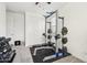 Functional home gym equipped with weightlifting station, dumbbells, and ceiling fan at 670 S Beebe St, Gilbert, AZ 85296