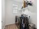 Modern laundry room equipped with front load washer and dryer and storage shelf at 670 S Beebe St, Gilbert, AZ 85296