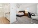 Spacious main bedroom with ensuite bathroom, ample lighting, and a comfortable work space at 670 S Beebe St, Gilbert, AZ 85296