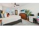 Comfortable main bedroom with a desk area, large dresser, and multiple windows for natural light at 670 S Beebe St, Gilbert, AZ 85296
