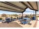 Community outdoor seating area with picnic tables and built-in barbeque grills at 670 S Beebe St, Gilbert, AZ 85296