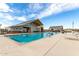 The community pool offers a refreshing retreat with lounge chairs, sun umbrellas, and a modern pavilion for ultimate relaxation at 670 S Beebe St, Gilbert, AZ 85296