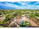 An aerial view of the home shows the inviting pool and perfectly manicured lawn at 6701 E San Miguel Ave, Paradise Valley, AZ 85253