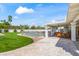 Landscaped backyard featuring a pool with a safety fence and a covered patio area at 6701 E San Miguel Ave, Paradise Valley, AZ 85253