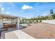 Large backyard with patio area, pool, manicured lawn, and desert views in the distance at 6701 E San Miguel Ave, Paradise Valley, AZ 85253