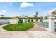 Green backyard featuring a pool area, trimmed bushes, and desert mountain views at 6701 E San Miguel Ave, Paradise Valley, AZ 85253
