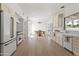 Charming kitchen with white cabinetry, stainless steel appliances, breakfast nook with plenty of natural light at 6701 E San Miguel Ave, Paradise Valley, AZ 85253