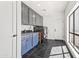 Well-equipped laundry room with custom cabinetry and modern washer and dryer at 6701 E San Miguel Ave, Paradise Valley, AZ 85253