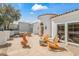Outdoor patio featuring flagstone pavers, comfortable seating, and gas fireplace at 6701 E San Miguel Ave, Paradise Valley, AZ 85253
