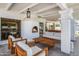 Covered patio with an outdoor fireplace, modern furniture and exposed beam ceilings at 6701 E San Miguel Ave, Paradise Valley, AZ 85253