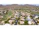Aerial view of homesites in gated golf community in desert mountain setting with golf course winding through at 7130 E Saddleback St # 58, Mesa, AZ 85207