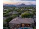 Breathtaking mountain views surround this desert home with a private pool and covered patio at 7130 E Saddleback St # 58, Mesa, AZ 85207