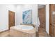 Bathroom featuring a soaking tub, tiled shower, and wood cabinets at 7130 E Saddleback St # 58, Mesa, AZ 85207