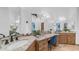 Bright bathroom with granite countertops, and sinks, and crystal light fixtures at 7130 E Saddleback St # 58, Mesa, AZ 85207
