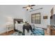 A bedroom with a tall ceiling, area rug, and bedside tables at 7130 E Saddleback St # 58, Mesa, AZ 85207