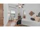 Bright bedroom with hardwood floors, modern ceiling fan, and neutral decor at 7130 E Saddleback St # 58, Mesa, AZ 85207