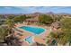 Resort-style community pool and spa with lounge chairs, lush landscaping, and scenic mountain views at 7130 E Saddleback St # 58, Mesa, AZ 85207