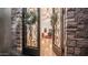 Elegant entryway with wrought iron doors, stone accents, and views of the interior's stylish decor at 7130 E Saddleback St # 58, Mesa, AZ 85207