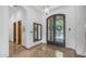 Grand foyer featuring marble floors, iron double doors, a mirror, and ample natural light at 7130 E Saddleback St # 58, Mesa, AZ 85207