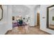 Hallway leading to the dining room features marble floors, arched doorways, and sophisticated decor at 7130 E Saddleback St # 58, Mesa, AZ 85207