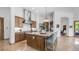 Open kitchen with granite countertops, a center island with seating, and wooden cabinetry at 7130 E Saddleback St # 58, Mesa, AZ 85207