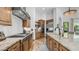Gourmet kitchen featuring custom cabinets, granite countertops, stainless steel appliances, and tile flooring at 7130 E Saddleback St # 58, Mesa, AZ 85207