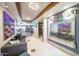 A stylish lobby featuring modern decor, with a waterfall feature, comfortable seating and glimpses of the fitness center at 7130 E Saddleback St # 58, Mesa, AZ 85207